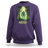 Purple sweatshirt with front Bigfoot hunting graphic and crew neck cuffs