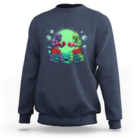Navy crewneck sweatshirt with boxing Bigfoot vs alien graphic on the front.