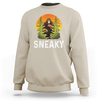 Sand crewneck sweatshirt with Bigfoot graphic and "SNEAKY" text