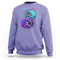 Violet crewneck sweatshirt with turquoise and purple flower graphic and 'choose to keep going' text