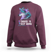 Maroon sweatshirt with wolf graphic and 'CHOOSE TO KEEP GOING' front print