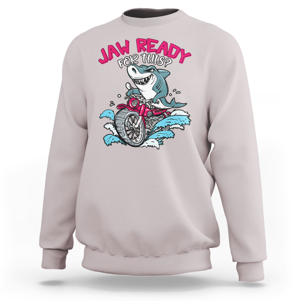 Light gray crewneck sweatshirt with shark-on-motorbike graphic and 'JAW READY FOR THIS?' text.