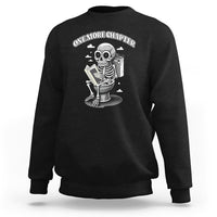 Black sweatshirt with skeleton holding a book graphic on the chest.