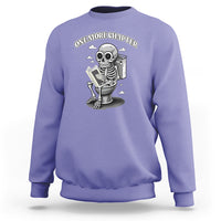 Violet sweatshirt with skeleton holding a book graphic on the chest.