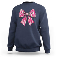 Girl's camouflage bow sweatshirt in navy with pink bow graphic at the chest