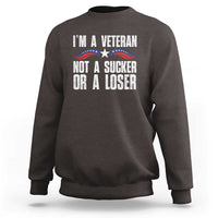 Dark chocolate sweatshirt with “I’m a Veteran” slogan and patriotic star graphic on front