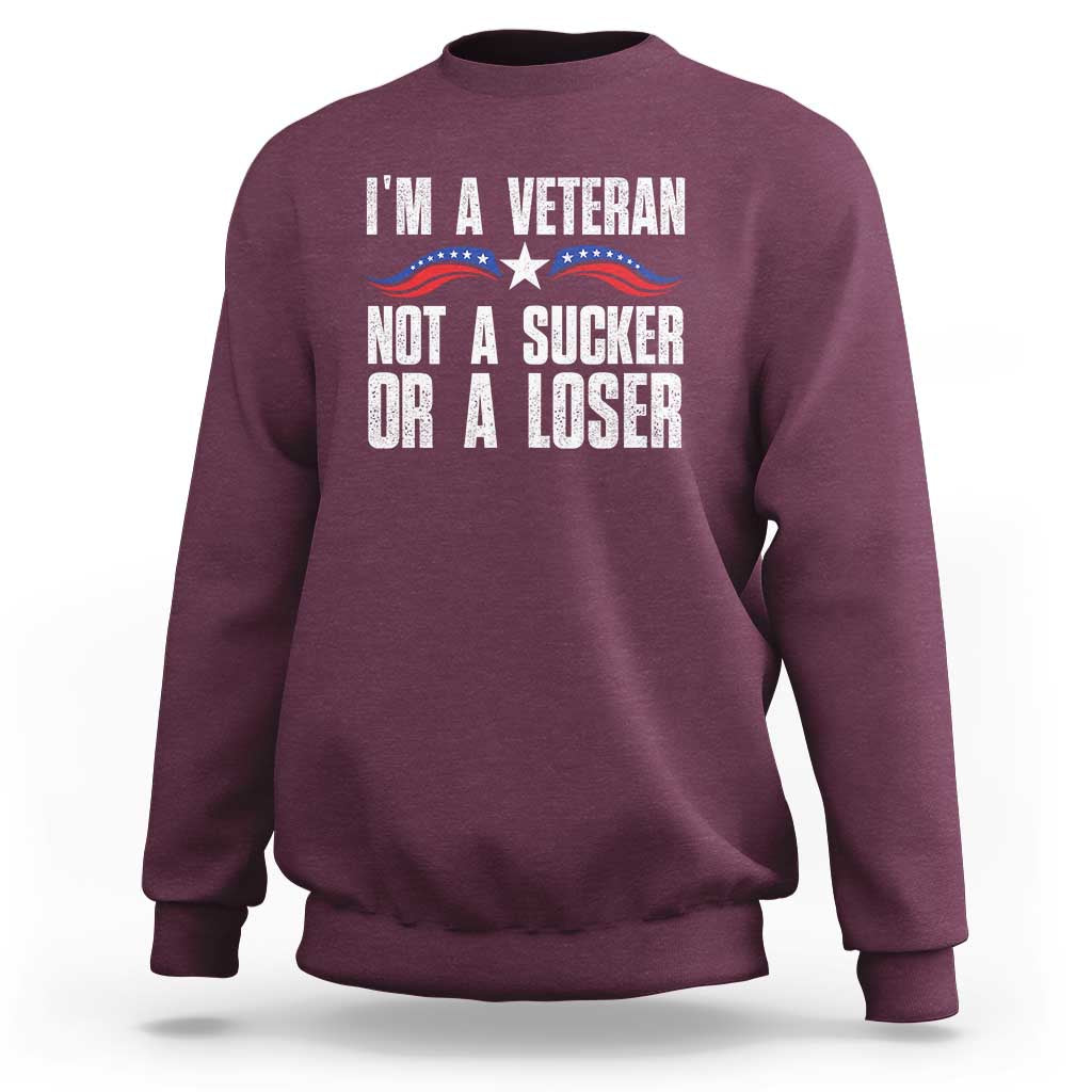 Maroon sweatshirt with “I’m a Veteran” slogan and patriotic star graphic on front