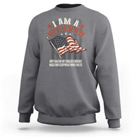 Veteran pride sweatshirt in charcoal gray with veteran emblem, flag and slogan graphic.