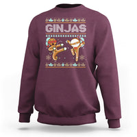 Maroon sweatshirt with festive ninja gingerbread graphic on front