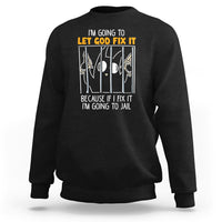 Black crewneck sweatshirt with front text graphic: “LET GOD FIX IT”