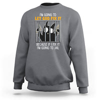 Charcoal crewneck sweatshirt with front text graphic: “LET GOD FIX IT”