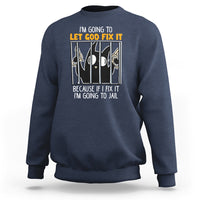 Navy crewneck sweatshirt with front text graphic: “LET GOD FIX IT”
