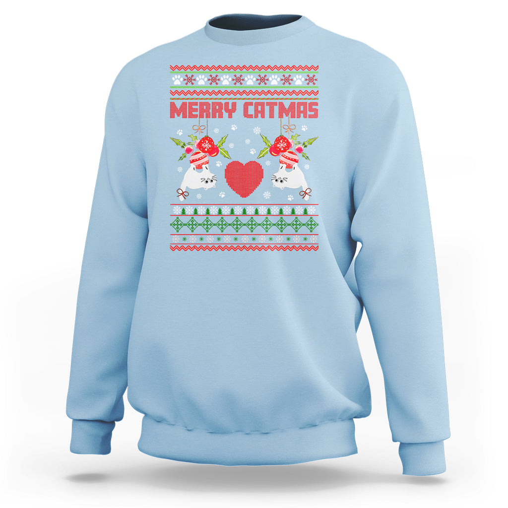 Light blue crewneck Christmas sweatshirt with “Merry Catmas” cat graphic and festive border