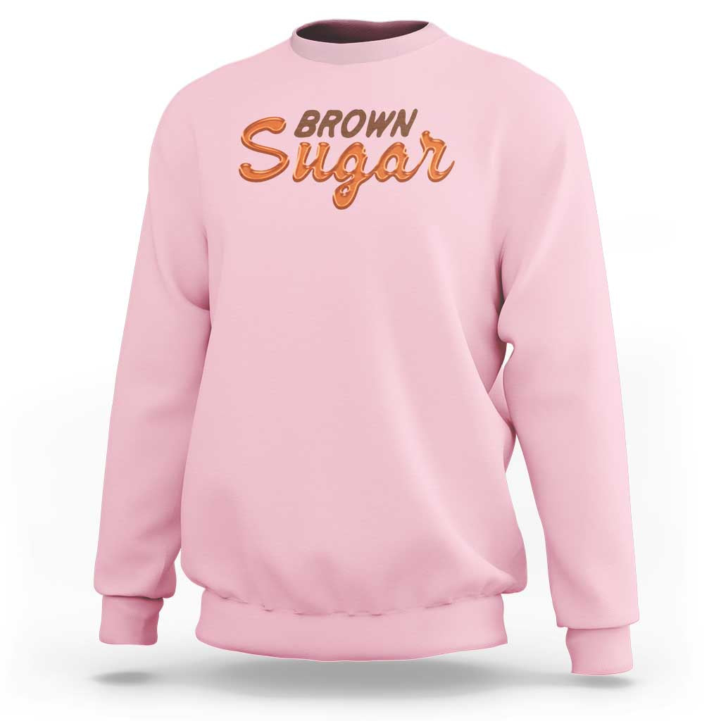 Men's light pink crewneck sweatshirt with orange 'BROWN Sugar' logo on chest