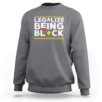 Heather gray sweatshirt with “Legalize Being Black” graphic across the chest.
