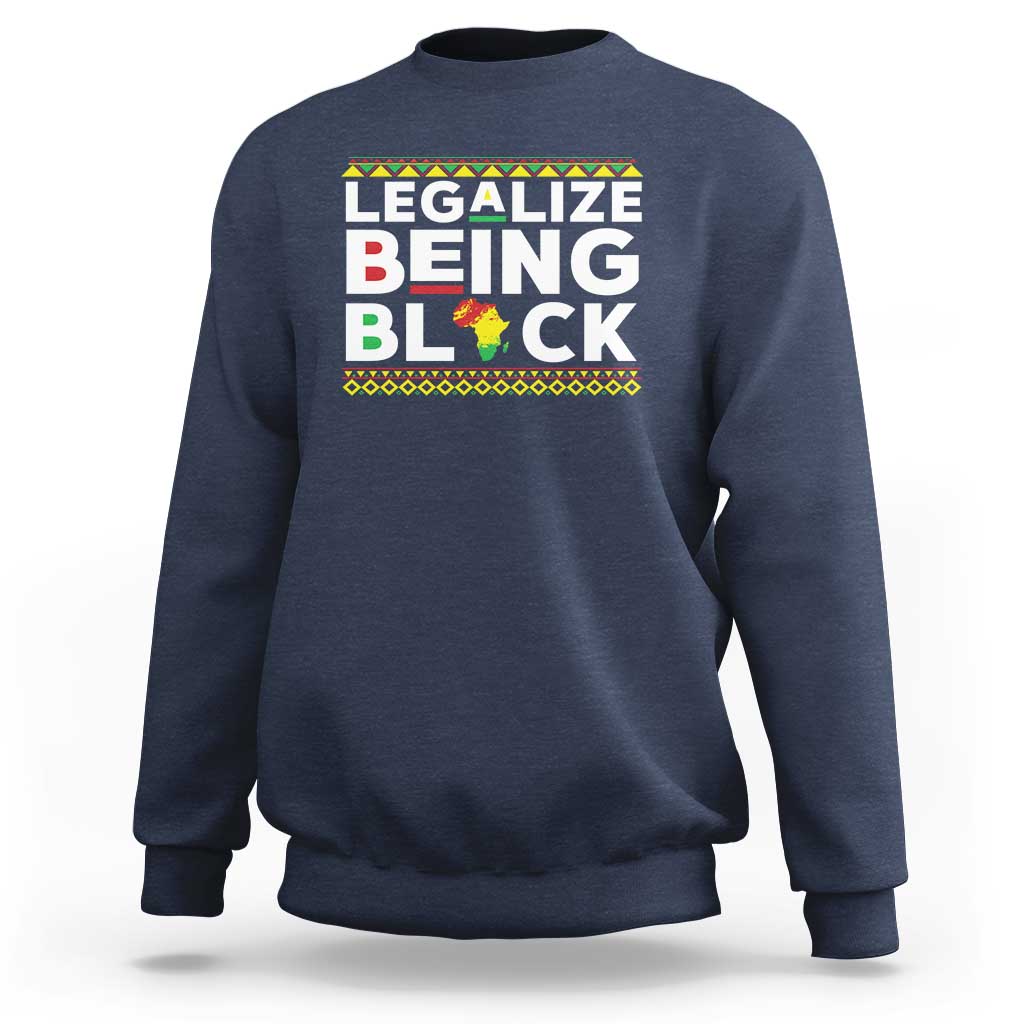 Navy blue sweatshirt with “Legalize Being Black” graphic across the chest.