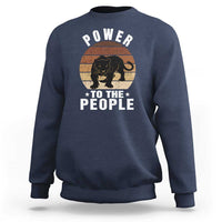 Navy sweatshirt with “POWER TO THE PEOPLE” panther graphic on front