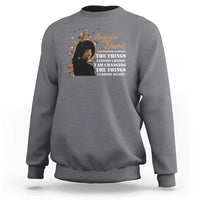 Charcoal gray crewneck sweatshirt with Angela Davis graphic and activist quote print on chest