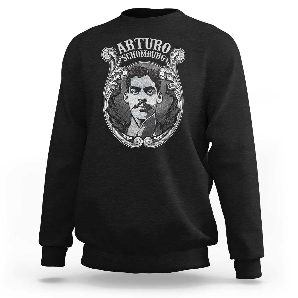 Black crewneck sweatshirt with large Arturo Schomburg portrait graphic on chest