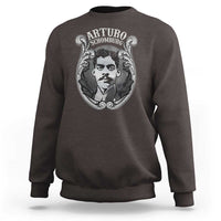 Dark chocolate crewneck sweatshirt with large Arturo Schomburg portrait graphic on chest