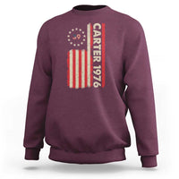Maroon crewneck sweatshirt with vertical “Carter 1976” and American flag graphic