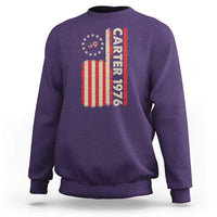 Purple crewneck sweatshirt with vertical “Carter 1976” and American flag graphic