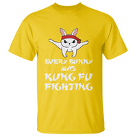 Daisy yellow crewneck T-shirt with cartoon bunny and martial-arts slogan graphic on front.