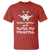 Red crewneck T-shirt with cartoon bunny and martial-arts slogan graphic on front.