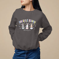 Dark chocolate crewneck sweatshirt with “Snuggle Bunny delivery co.” bunny graphic on chest.