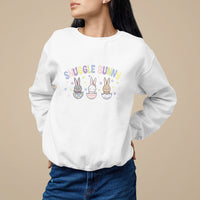 White crewneck sweatshirt with “Snuggle Bunny delivery co.” bunny graphic on chest.
