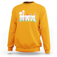Gold/yellow sweatshirt with bunny and colorful tooth graphic across the chest