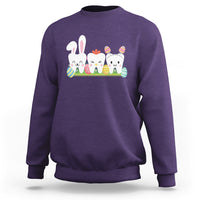 Purple sweatshirt with bunny and colorful tooth graphic across the chest
