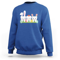 Royal blue sweatshirt with bunny and colorful tooth graphic across the chest