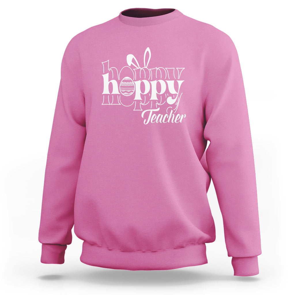 Azalea pink crewneck sweatshirt with white “Happy Hoppy Teacher” bunny and egg graphic