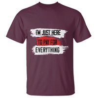 Maroon crew-neck T-shirt with distressed 'I'm just here' to pay for everything text