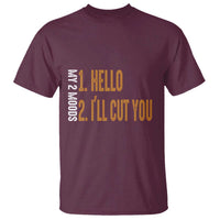 Maroon crew-neck T-shirt with colorful “HELLO” and “I’ll CUT YOU” text graphic on chest