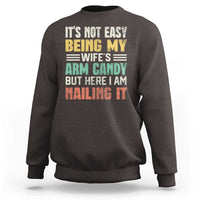 Men's crewneck sweatshirt in dark chocolate with colorful front text graphic