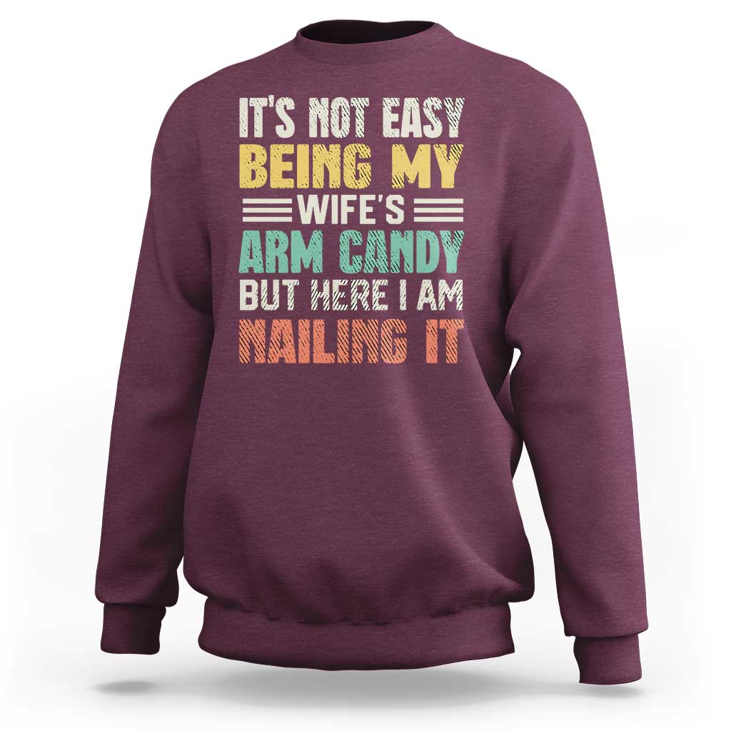 Men's crewneck sweatshirt in maroon with colorful front text graphic