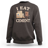 Dark chocolate crewneck sweatshirt with 'EAT CEMENT' cat graphic on front