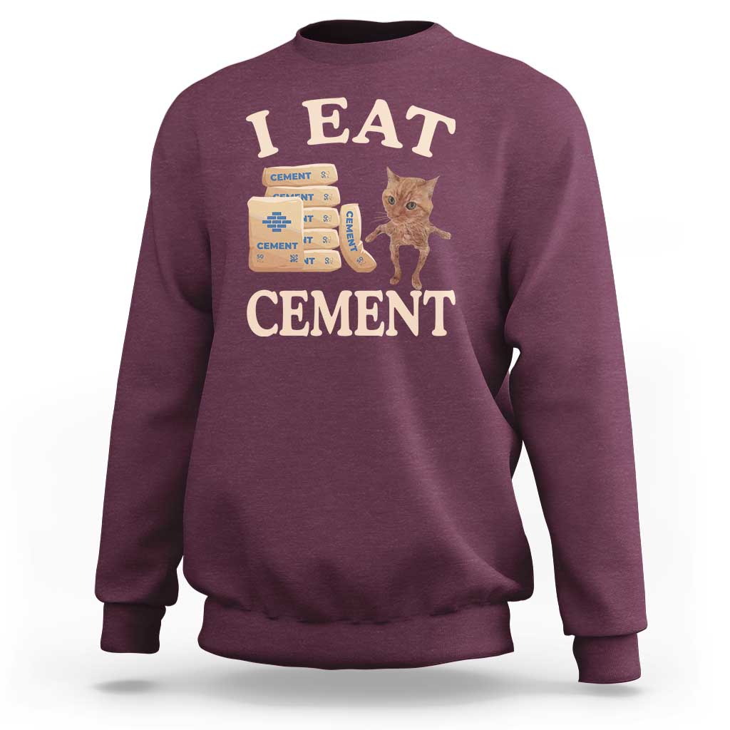 Maroon crewneck sweatshirt with 'EAT CEMENT' cat graphic on front