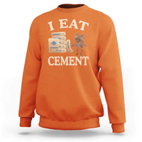 Orange crewneck sweatshirt with 'EAT CEMENT' cat graphic on front