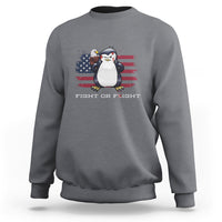 Charcoal crewneck sweatshirt with penguin and U.S. flag graphic, “FIGHT OR FLIGHT” text.