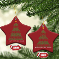 Two red star-shaped Christmas ornaments with gold star details, binary “Happy New Year” text on cords.