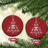 Pair of red round ornaments with pi symbol pattern, hanging from gold strings.