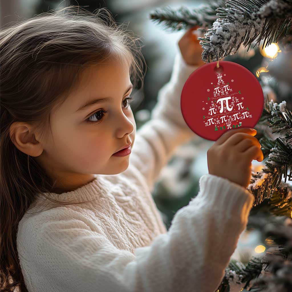 Red round ornament with pi symbols, hanging from a gold string held on a Christmas tree.