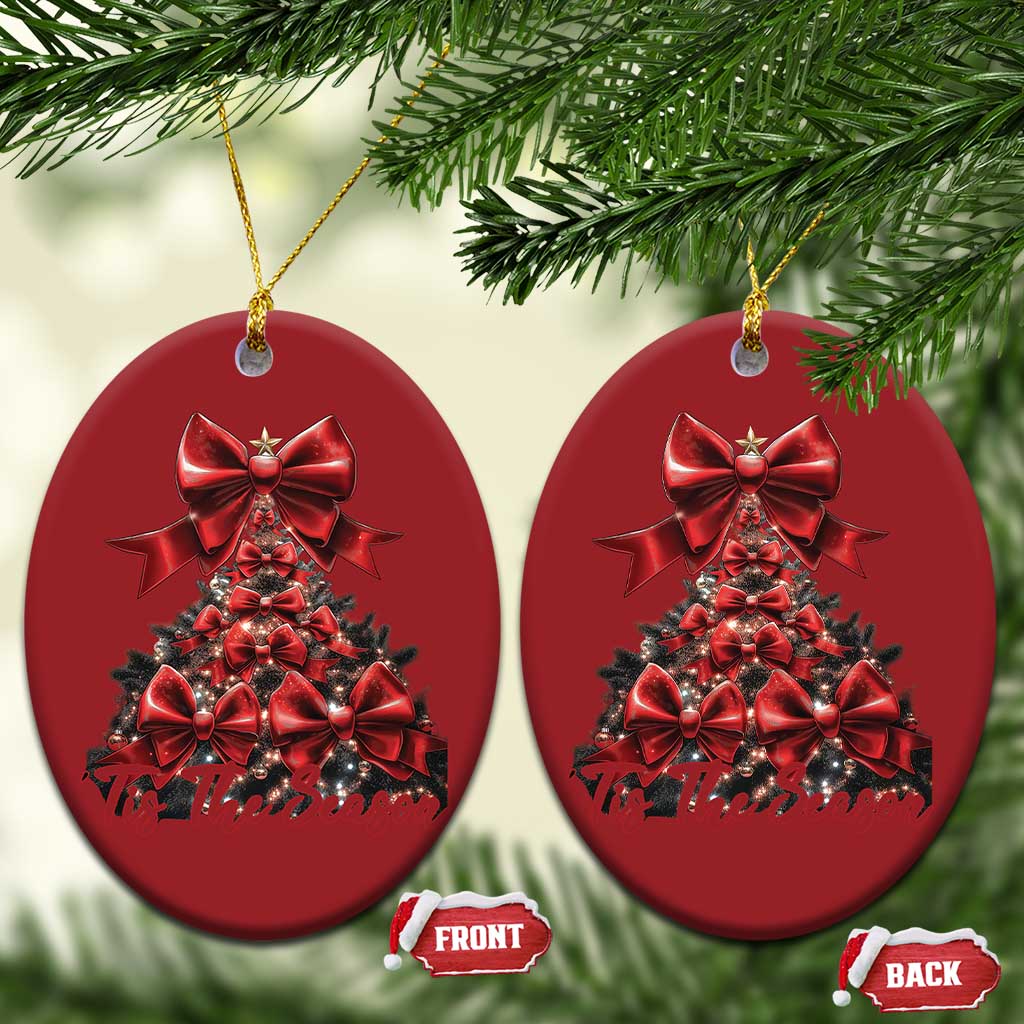 Two red oval Christmas tree ornaments hanging on gold strings, front and back shown
