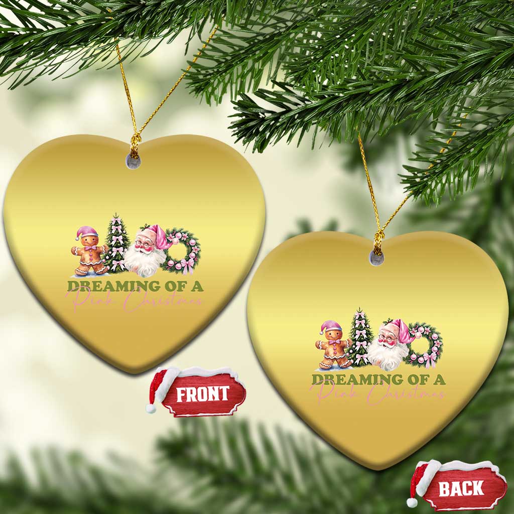 Two gold heart-shaped Christmas ornaments with pink holiday character graphic and cords
