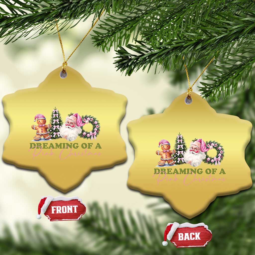 Two gold star-shaped Christmas ornaments with pink holiday character graphic and hanging cords