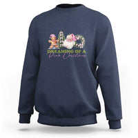 Navy crewneck sweatshirt with colorful holiday graphic of trees, wreath, and characters