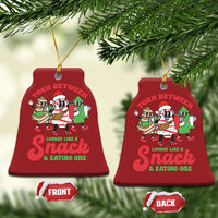 Red bell-shaped Christmas ornament with cartoon “Torn Between” snack design, front and back
